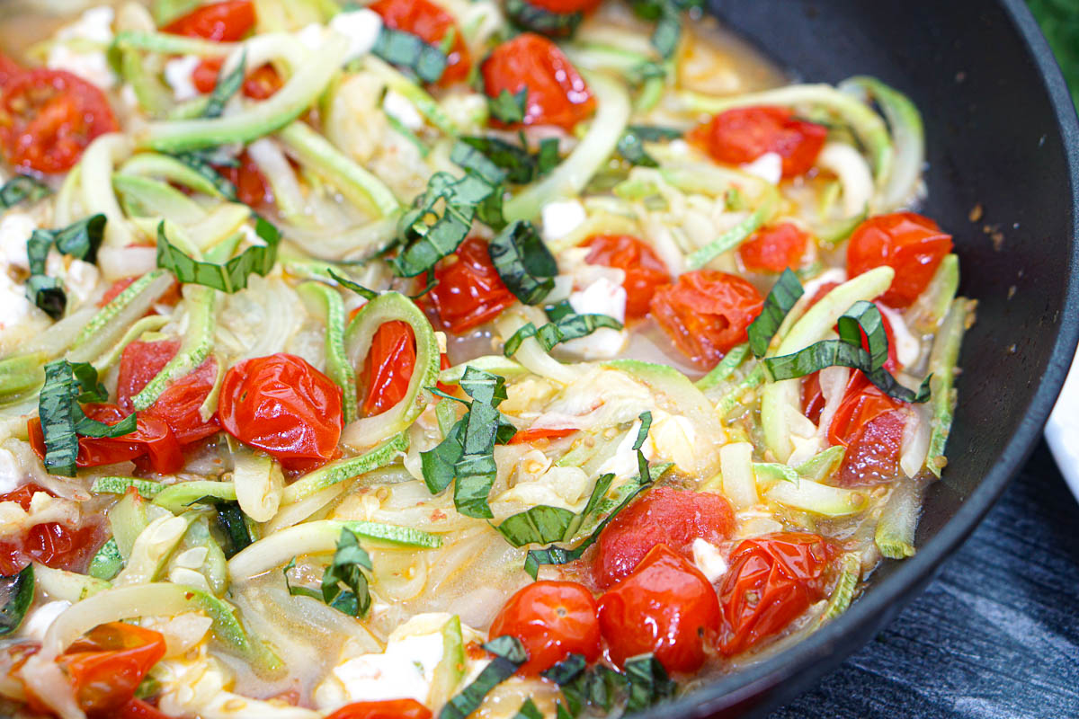 Closeup of a the pan with the finished low carb caprese pasta with zucchini noodles.