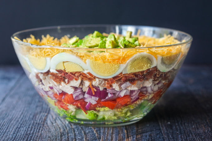 Layered salad in plastic cups. Perfect for picnics