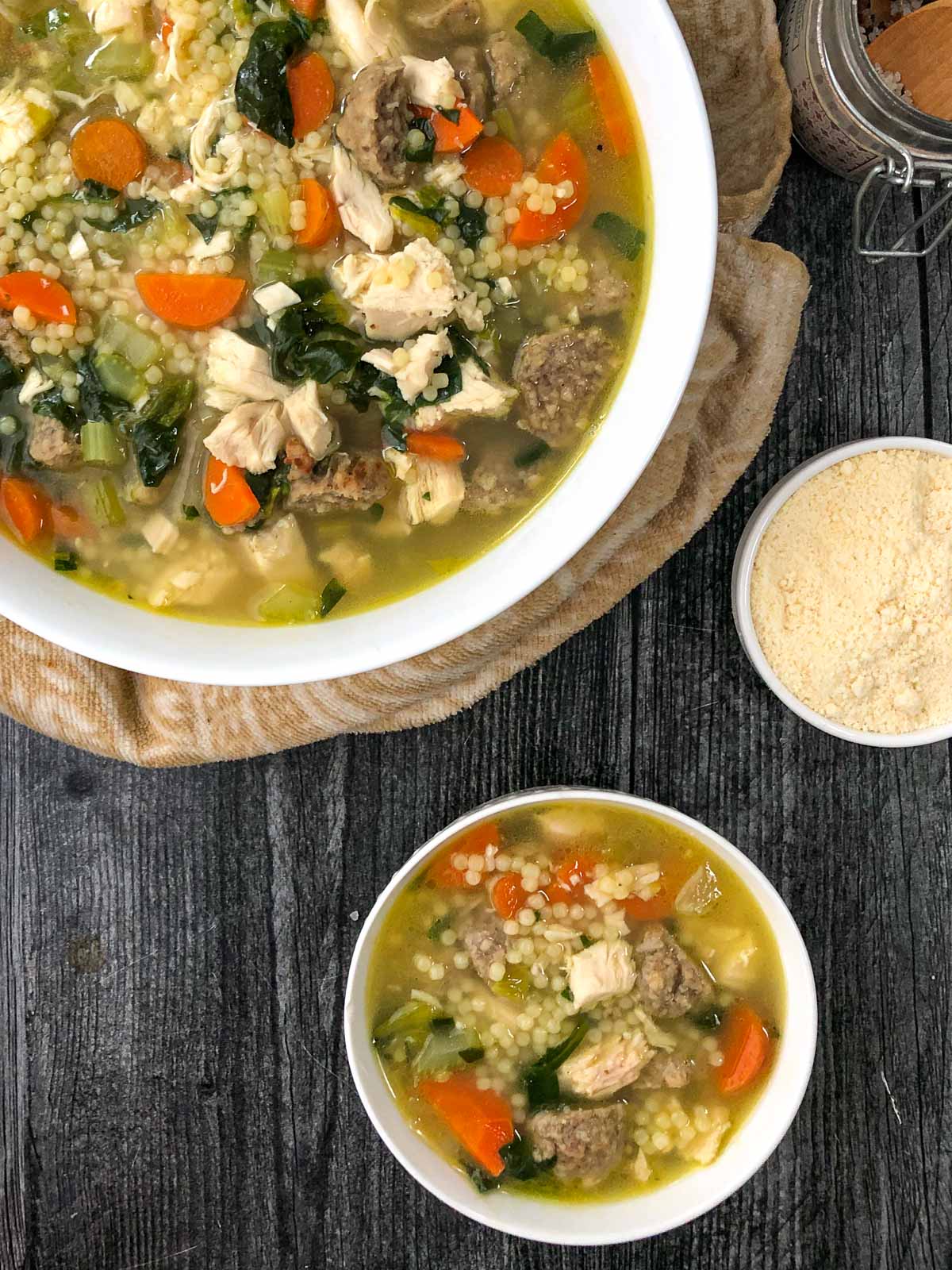 aerial view of a large and small bowl with wedding soup 