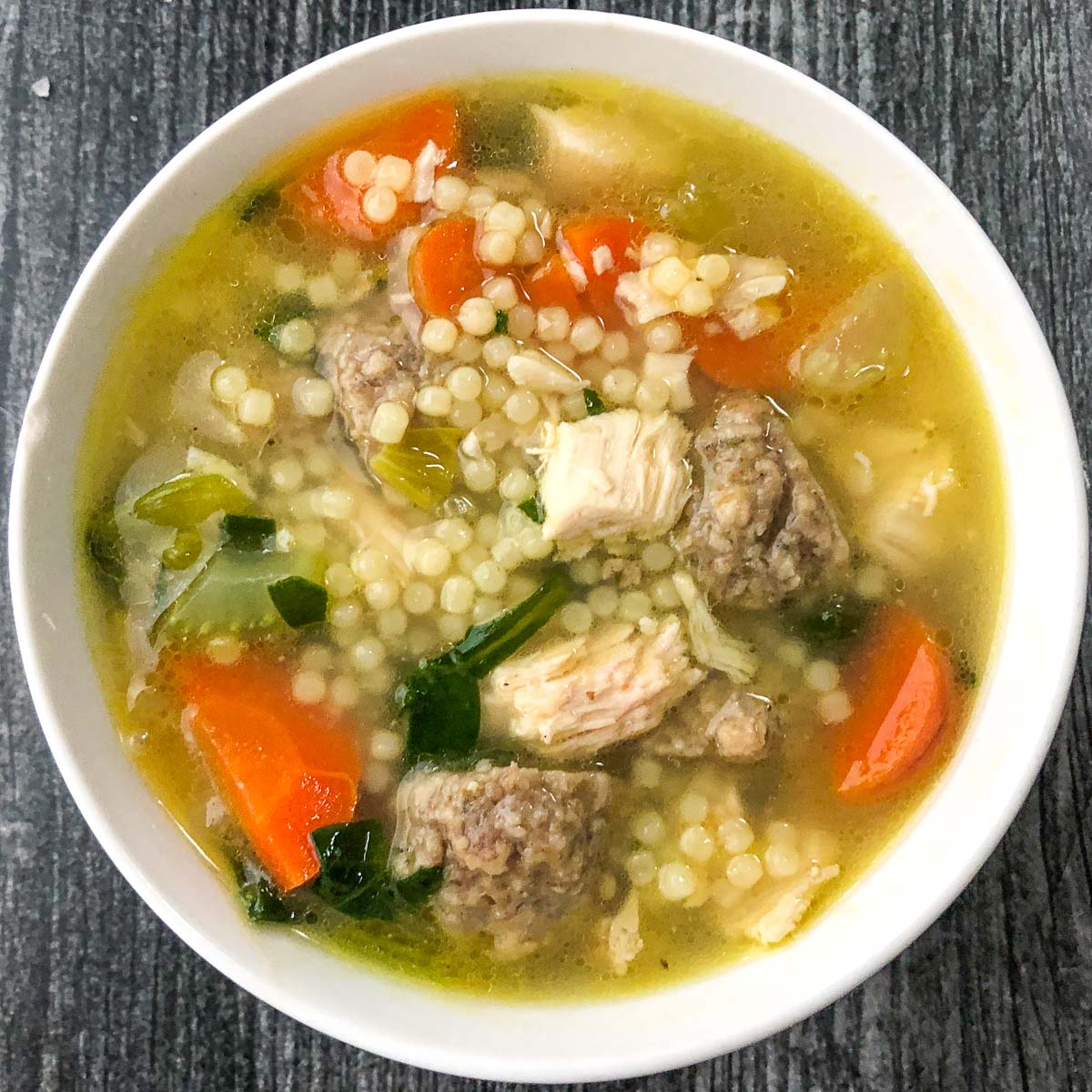 aerial view of a white bowl of wedding soup