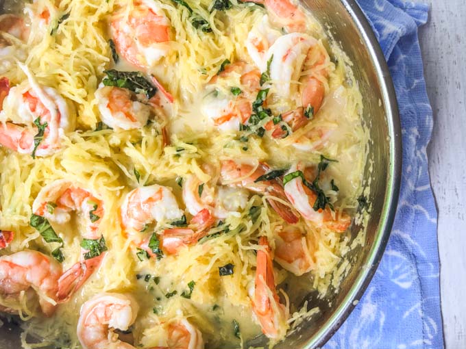 If you are a looking for a wonderful Thai flavored noodle dish, look no further. This coconut basil shrimp spaghetti squash recipe is full of flavor, low carb, gluten free and only takes about 20 minutes to make!