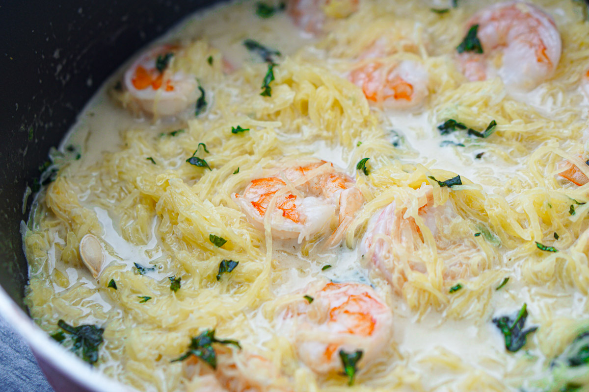 closeup of pan with coconut curry spaghetti squash and shrimp