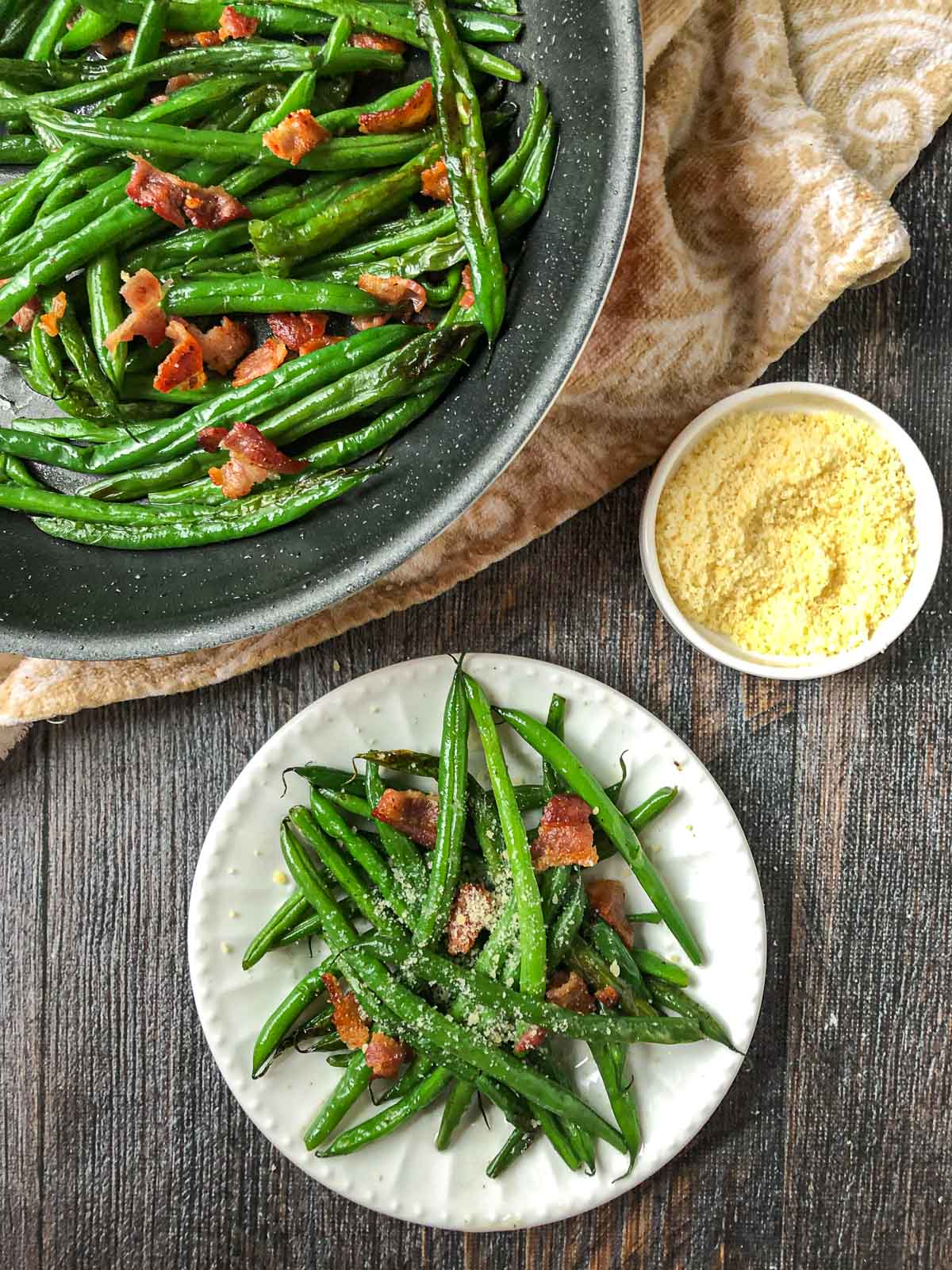aerial view of pan and plate with green beans with bits of bacon