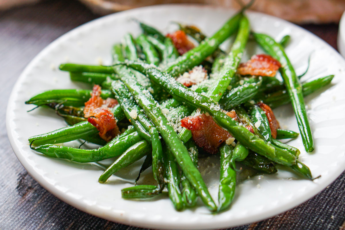 plate of green beans sprinkled with parmesan cheese