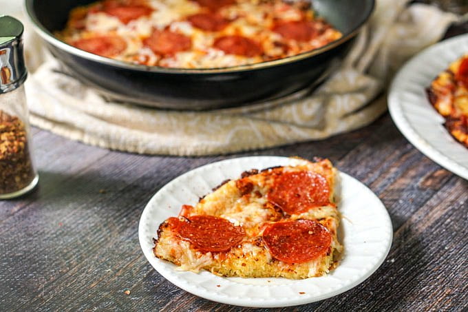 If you ever had spaghetti pizza, you will love this low carb version. Skillet spaghetti squash pizza is a low carb and gluten free answer to your pasta and pizza cravings. The recipe makes 8 big servings as only 4.4g net carbs!