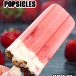 Closeup of a low carb strawberry cheesecake popsicle with text overlay.