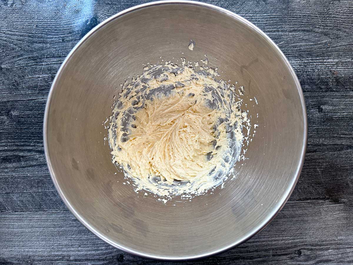 Silver bowl with whipped cheesecake mixture.