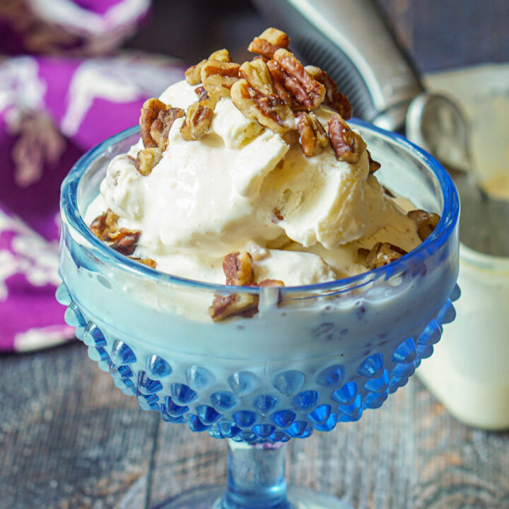 blue glass dish with keto butter pecan ice cream