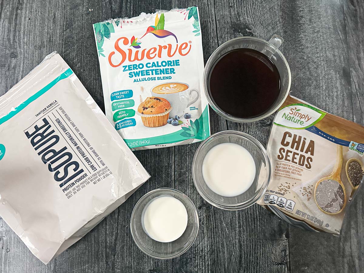 Recipe ingredients - protein powder, chia seeds, cream, almond milk, brewed coffee and sweetener.
