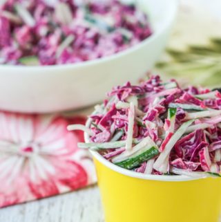 This cucumber slaw with margarita dressing is a delicious low carb salad that would be perfect for your next bbq or picnic. A delicious way to use some of those garden cucumbers! The low carb creamy dressing has the sweet and tart taste of a margarita.