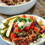white bowl with slow cooker pulled pork and white bowl with rice bowl and text