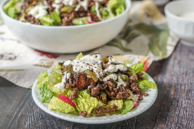 This low carb Philly cheesesteak salad is the answer to your cheesesteak cravings. It's easy to make. The savory meat mixture over crunchy and cool lettuce are topped with a creamy Parmesan dressing. Only 5.3g per serving.