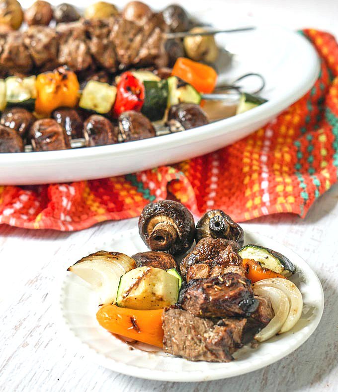 This marinated steak kebabs dinner is the perfect low carb dinner for a summer night. Marinate the steak in the morning, skewer and grill later so your whole dinner is cooked on the grill. 