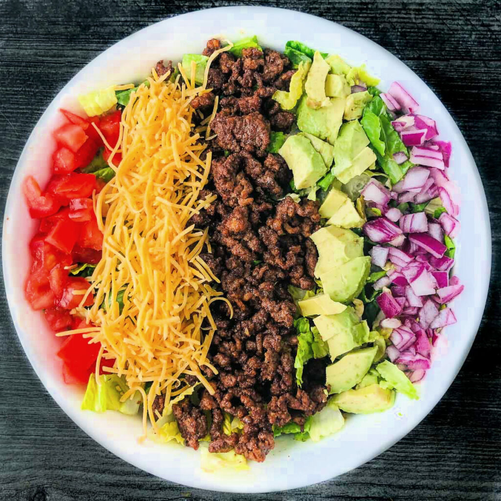 white bowl with colorful keto taco salad