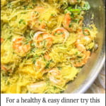 closeup of a pan of shrimp spaghetti squash with basil and text