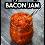 Glass jar with low carb tomato jam with bacon and caramelized onions and text.