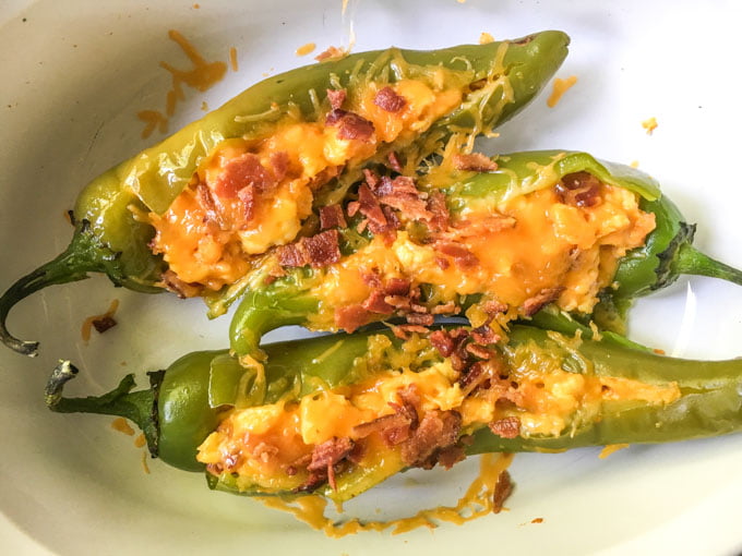 These low carb buffalo breakfast hatch chile peppers make for a delicious change from your standard eggs and bacon. A bit of spice along with cheese, chiles and bacon and you've got a low carb breakfast you can eat with your hands! Only 4.6g net carbs!