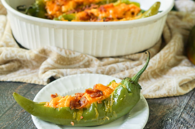 These low carb buffalo breakfast hatch chile peppers make for a delicious change from your standard eggs and bacon. A bit of spice along with cheese, chiles and bacon and you've got a low carb breakfast you can eat with your hands! Only 4.6g net carbs!