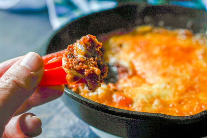 This low carb cheesy chorizo dip has a layer of spicy chorizo on the bottom and then is topped with 4 different cheese to make for a delicious low carb dip. A serving size of ¼ of the recipe has only 5.1g net carbs. Eat with peppers or other raw veggies.