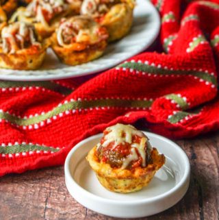 These low carb meatball sub cups are perfect finger food for your next football party. Each gluten free cup is like a mini meatball sub with a tasty bread cup, marinara sauce, meatballs and cheese. Only 2.4g net carbs per cup.
