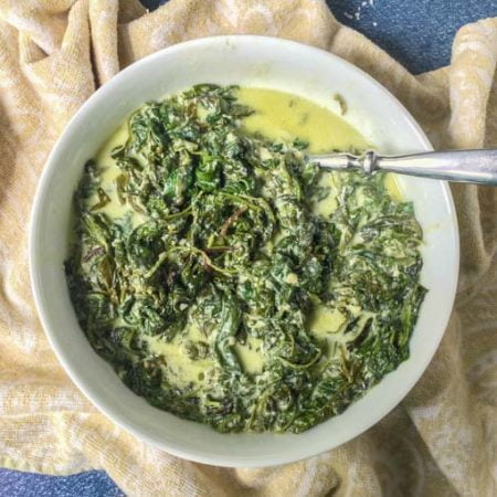 If you are looking for an easy low carb side dish, try this slow cooker greens Alfredo. Just a few ingredients to make this rich and creamy Alfredo sauce with a healthy dose of power greens. Only 4g net carbs per serving.