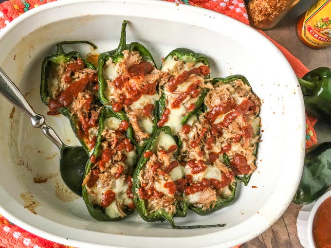 stuffed poblano peppers in baking dish