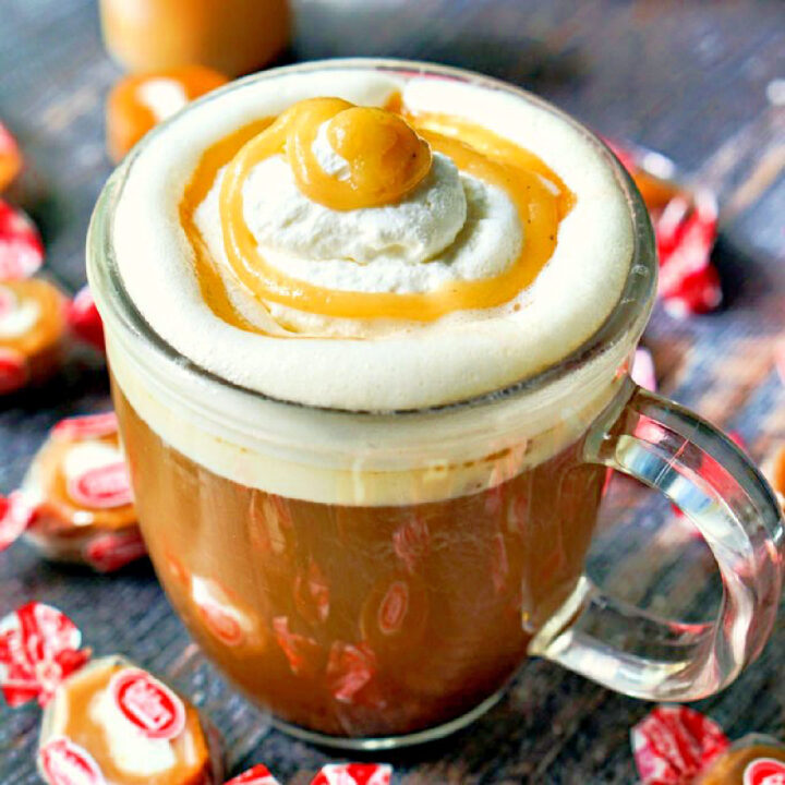 closeup of a mug of keto salted caramel coffee with candies nearby