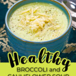 A blue bowl with a serving of creamy low carb broccoli cauliflower soup that you can make in the instant pot or stove top and text.