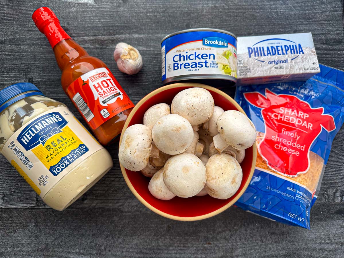 recipe ingredients - mayo, hot sauce, mushrooms, garlic, canned chicken, cream cheese, cheddar cheese