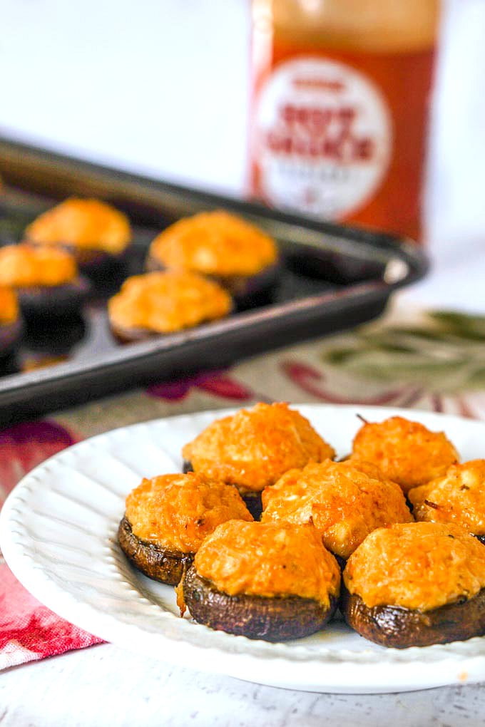 These buffalo chicken low carb stuffed mushrooms make for a delicious low carb or keto appetizer for your next holiday or football party. You can even at these as a low carb snack or meal! Five stuffed mushrooms only have 3g net carbs!