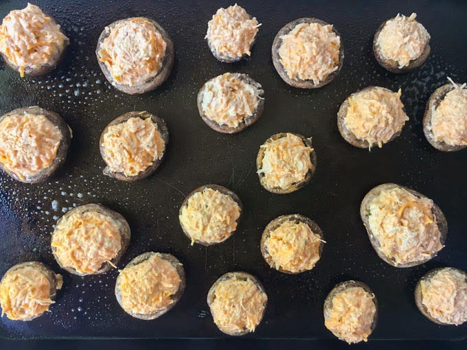 These buffalo chicken low carb stuffed mushrooms make for a delicious low carb or keto appetizer for your next holiday or football party. You can even at these as a low carb snack or meal! Five stuffed mushrooms only have 3g net carbs!