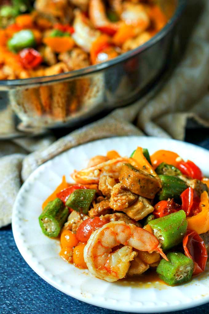 This low carb cajun stir fry dinner is full of flavorful ingredients like chicken, shrimp and sausage. You can make this one pan dinner in under 30 minutes and there is just 5.1g net carbs per serving!