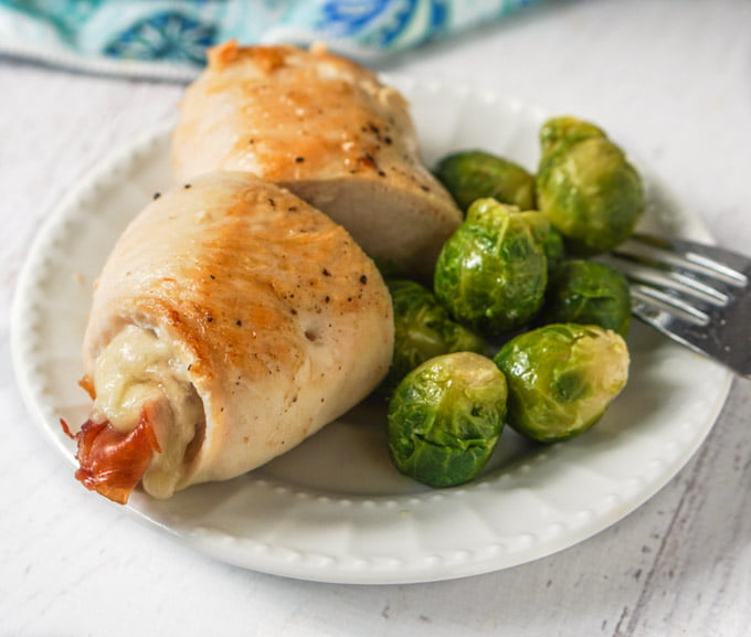 This easy chicken cordon bleu recipe is a simple dish you can make any day of the week. Using Swiss cheese, prosciutto all wrapped up in thin chicken cutlet. It's a naturally low carb dinner.