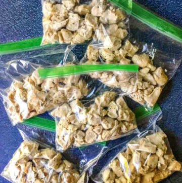 ziplock baggies with cooked chicken cubes for freezing