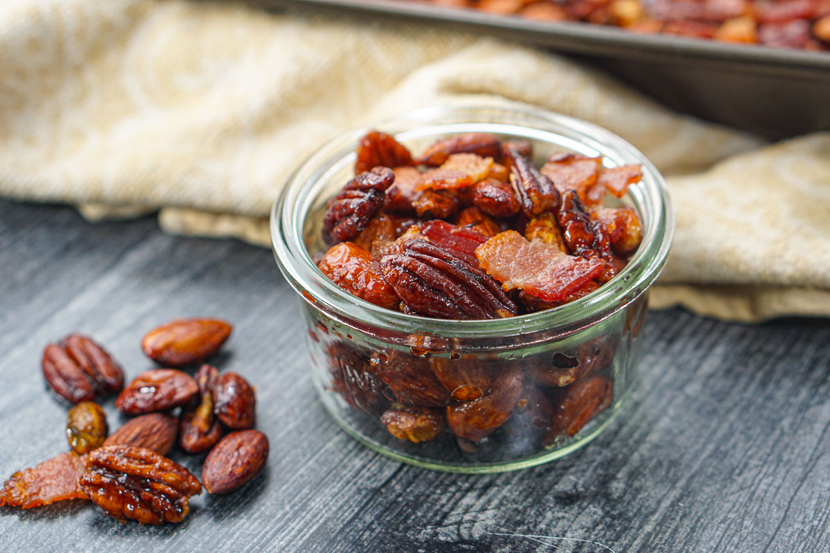 closeup of a jar of sugar free maple roasted nuts with bacon