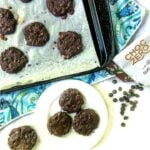 white plate and cookie sheet with chocolate keto brownie cookies and text overlay