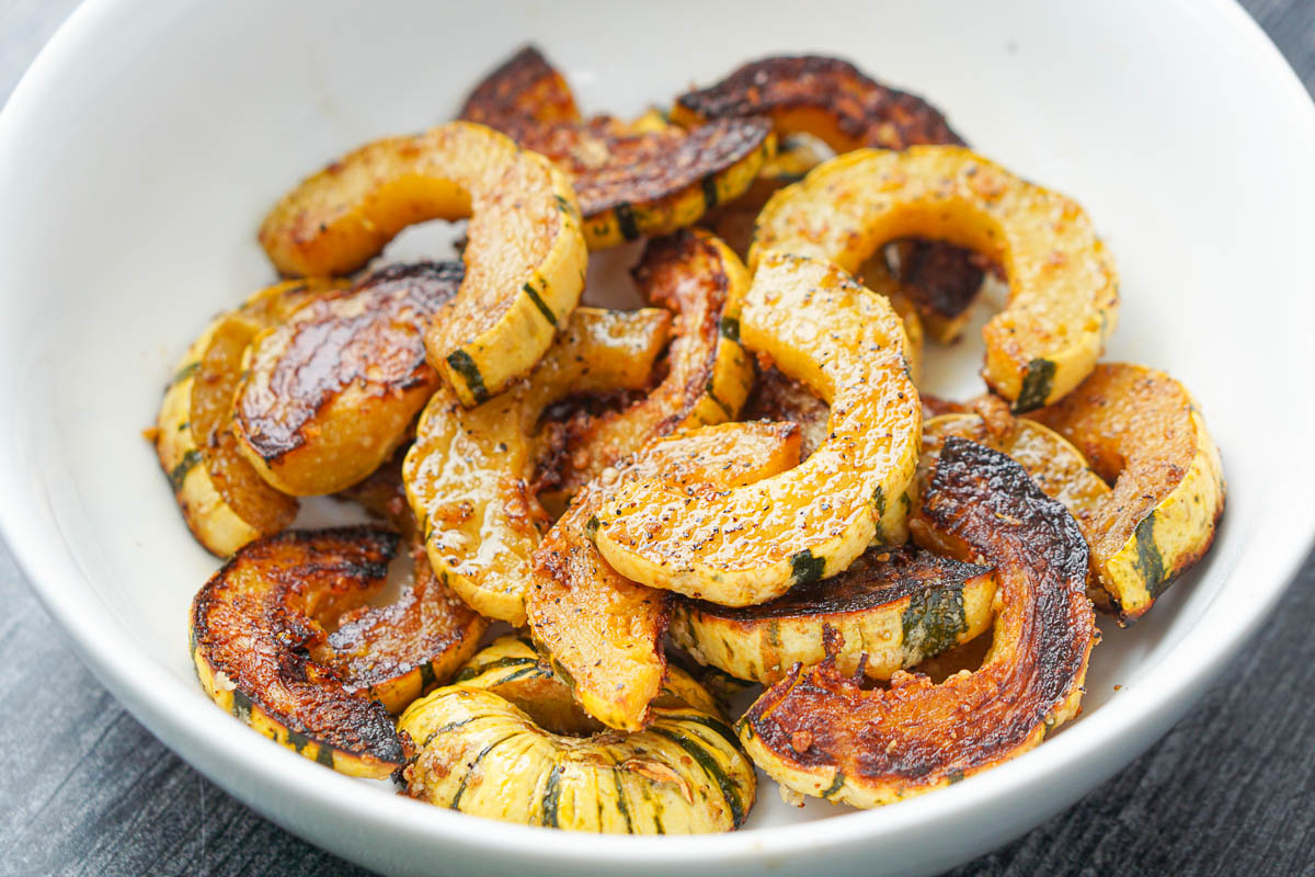 white bowl with roasted squash rings