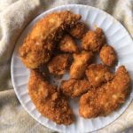 These crispy low carb chicken nuggets are quick and easy in the Air Fryer. Whip up a batch with just a few ingredients and the whole recipe has only 3.8g net carbs! 