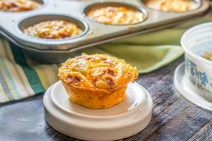 Landscape photo of low carb egg muffin with baking tray in background.