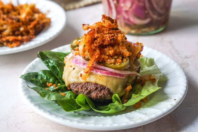 These keto butter burgers are so tasty as is but topped with low carb onion straws and pickled jalapeños they go to another level.