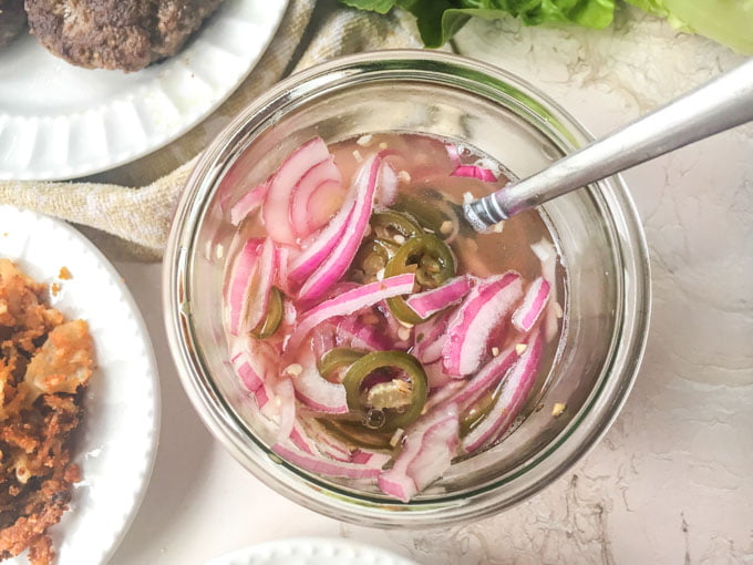 These keto butter burgers are so tasty as is but topped with low carb onion straws and pickled jalapeños they go to another level.