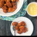 white plates with keto air fryer chicken nuggets and text