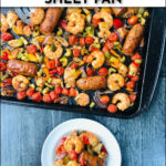 aerial view of baking sheet with cooked cajun sheet pan dinner and text