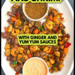 White platter with hibachi steak and shrimp with veggies and dipping sauces and text overlay.