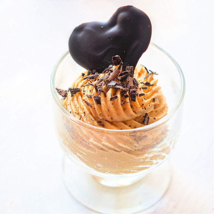 closeup of dessert dish with keto peanut butter mouse with a chocolate heart