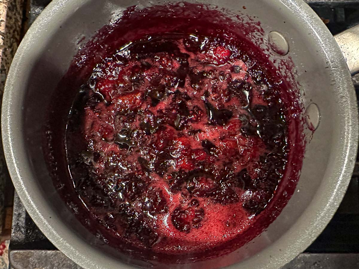 Saucepan with berry sauce.