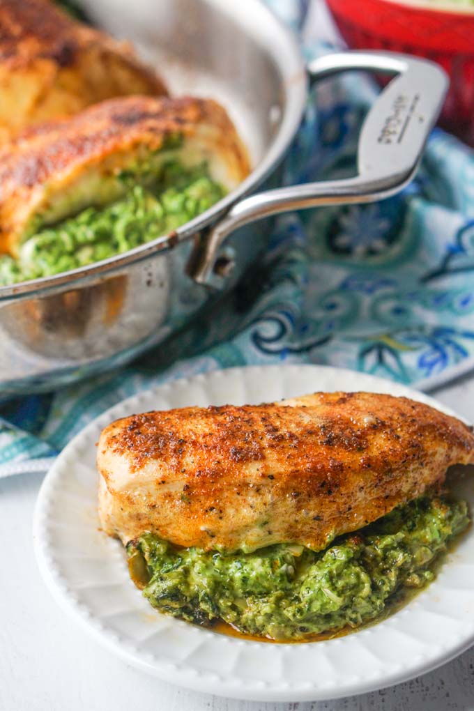 long photo of stuffed chicken breast with pan in the background