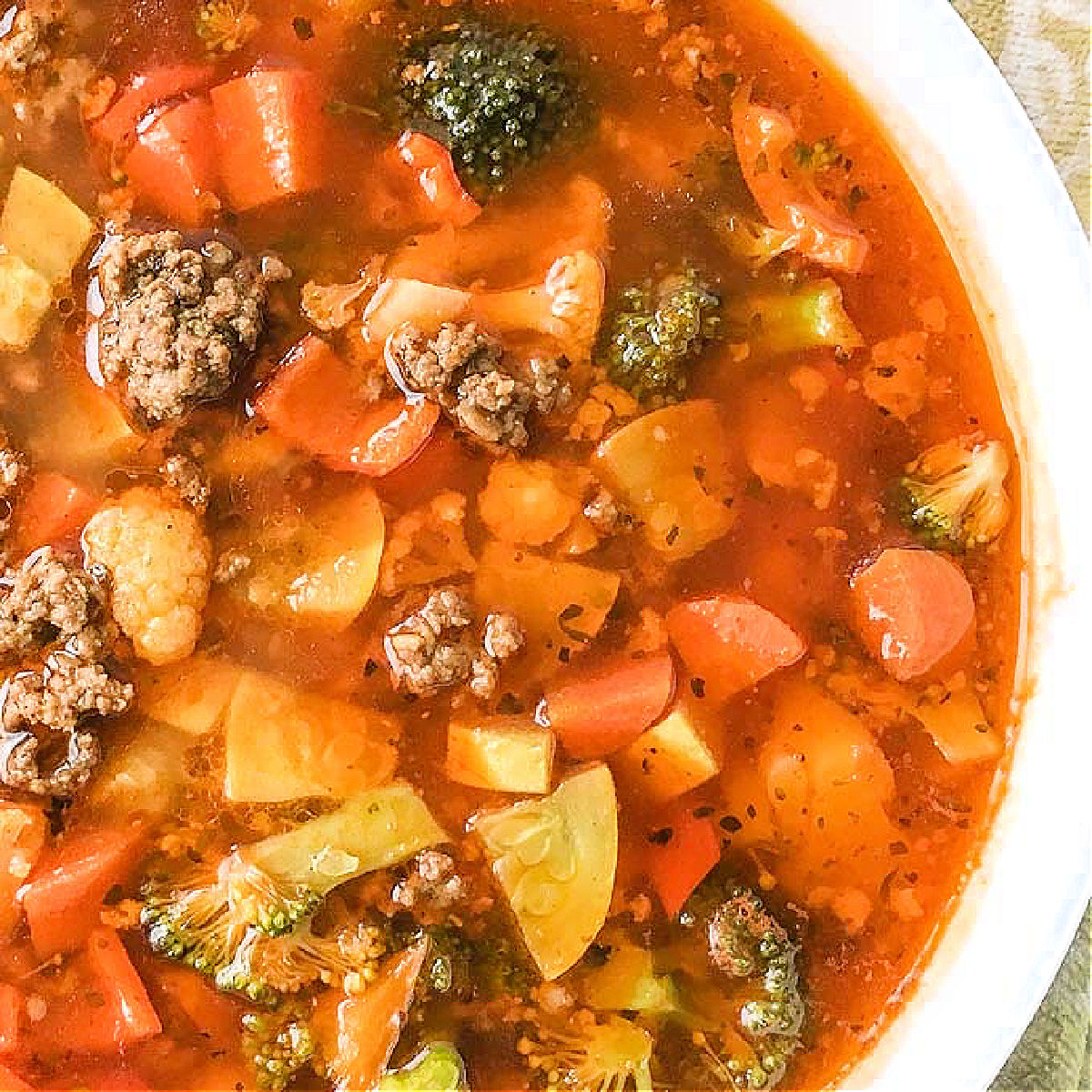 closeup of a big bowl of ground beef and vegetable taco soup