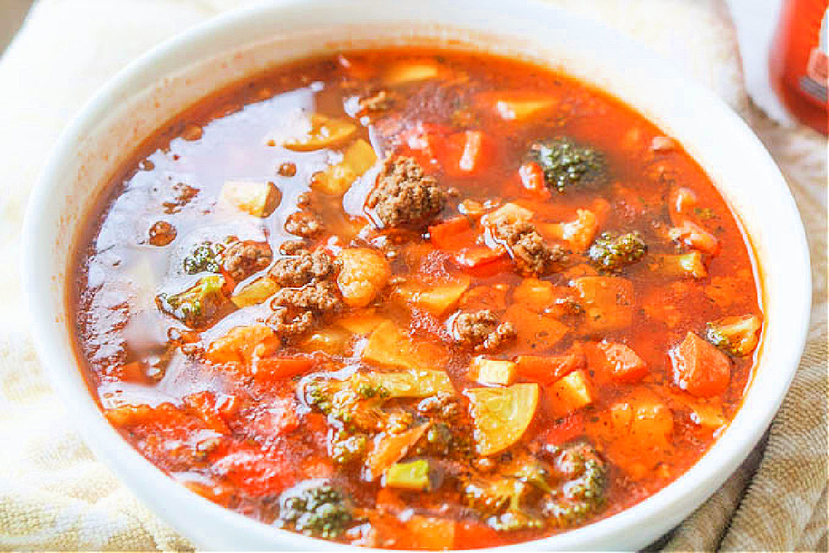 closeup of a big white bowl of keto taco soup