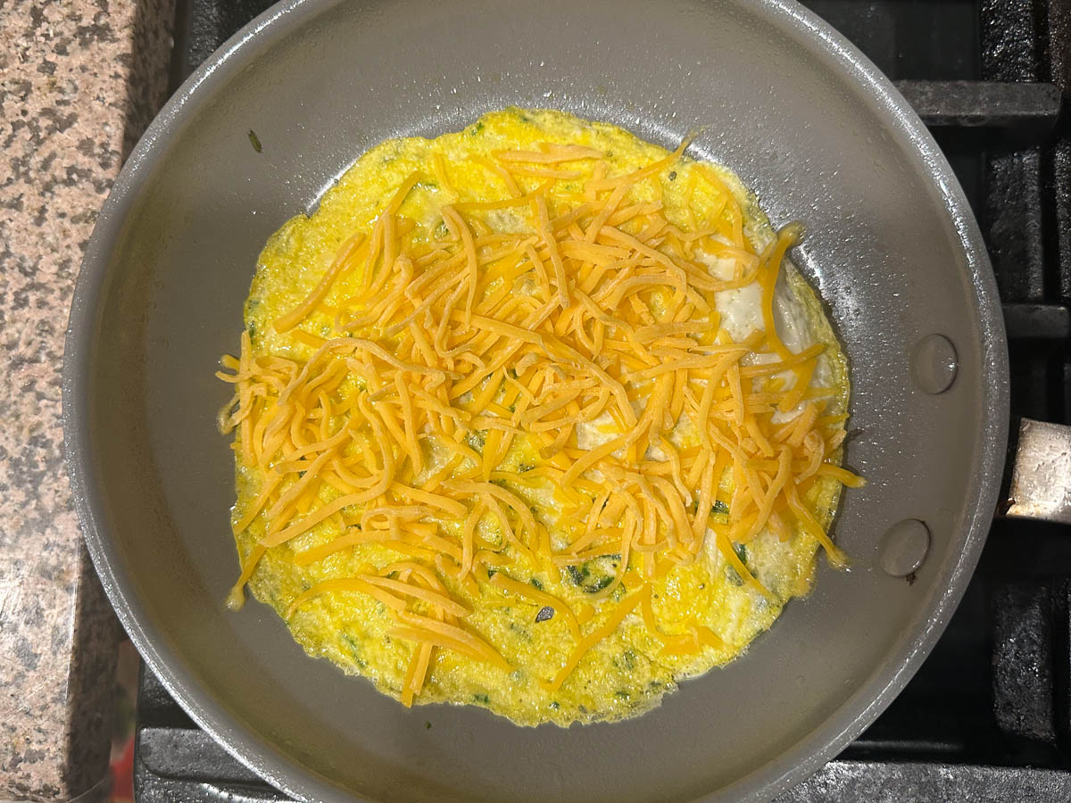 skillet with egg and cheese